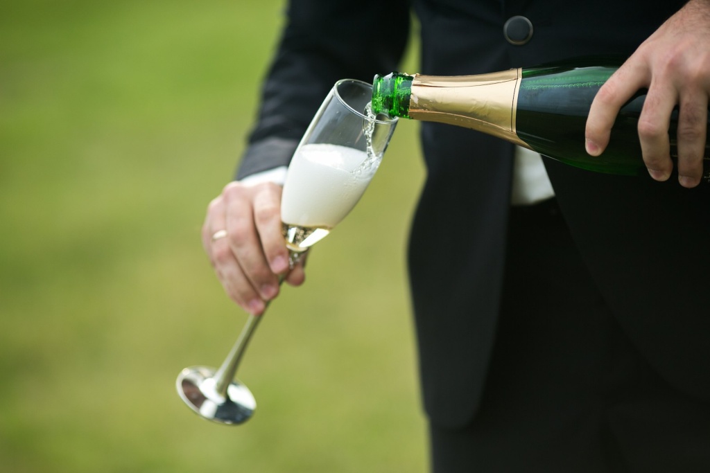 groom-serving-glass-champagne (1).jpg