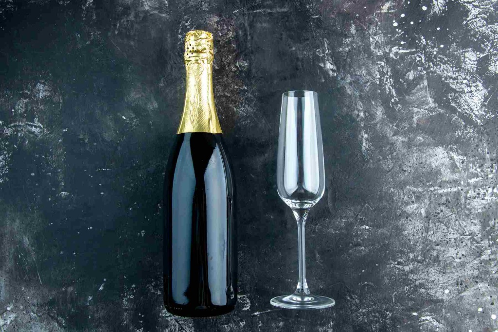 top-view-champagne-champagne-flute-dark-table (1).jpg