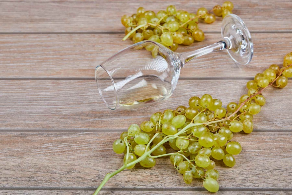 bunch-grapes-wine-glass-wooden-surface (1).jpg